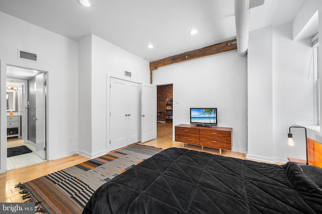 114 Naudain St Unit A, Philadelphia, PA 19147 - bedroom featuring wood finished floors, beamed ceiling, recessed lighting, a towering ceiling, and ensuite bath