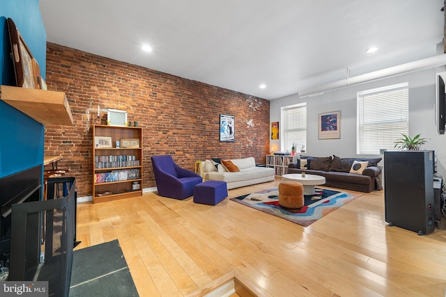 114 Naudain St Unit A, Philadelphia, PA 19147 - living area with hardwood / wood-style flooring, brick wall, and recessed lighting