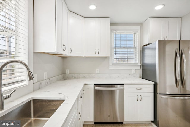 549 Madison Ave, Warminster, PA 18974 - kitchen featuring stainless steel appliances, white cabinetry, light stone countertops, and recessed lighting