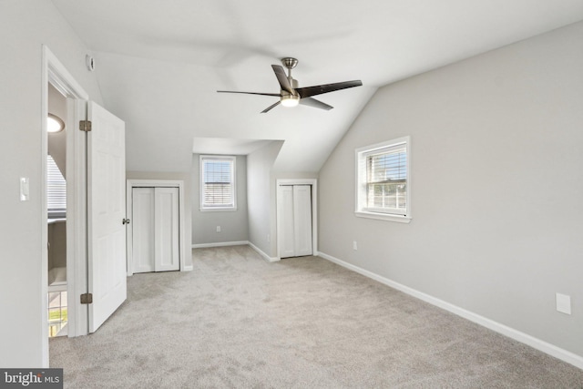 549 Madison Ave, Warminster, PA 18974 - unfurnished bedroom with carpet, multiple closets, lofted ceiling, and a ceiling fan