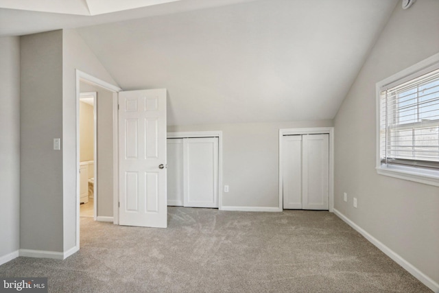 549 Madison Ave, Warminster, PA 18974 - unfurnished bedroom featuring two closets, lofted ceiling, and carpet flooring