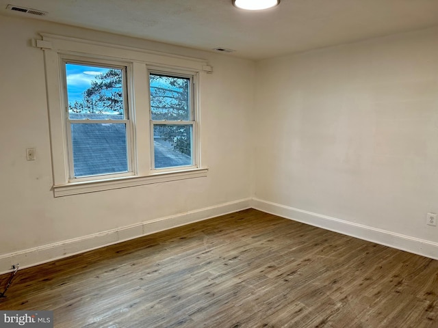 515 Dorsey, Essex, MD 21221 - spare room featuring baseboards and wood finished floors