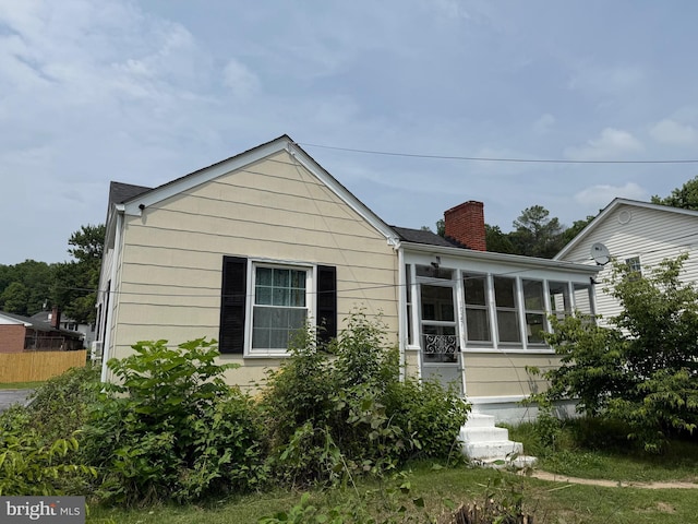1027 E Washington St, Strasburg, VA 22657 - bungalow with a chimney and a sunroom