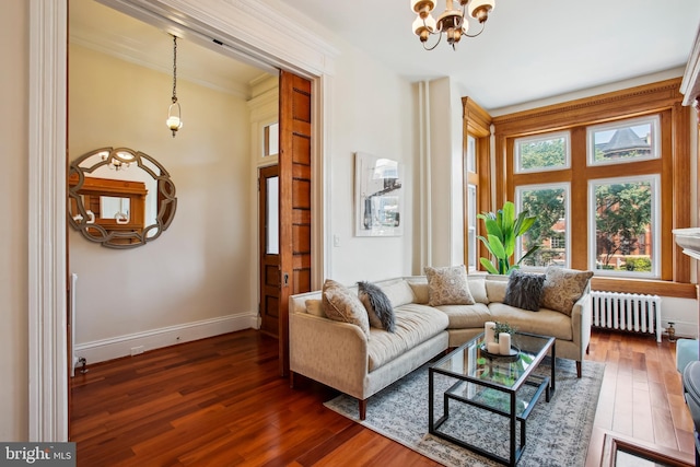 1240 Girard St NW, Washington, DC 20009 - living area featuring radiator heating unit, a chandelier, wood finished floors, and ornamental molding
