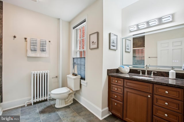 1240 Girard St NW, Washington, DC 20009 - bathroom with radiator heating unit, vanity, and tiled shower