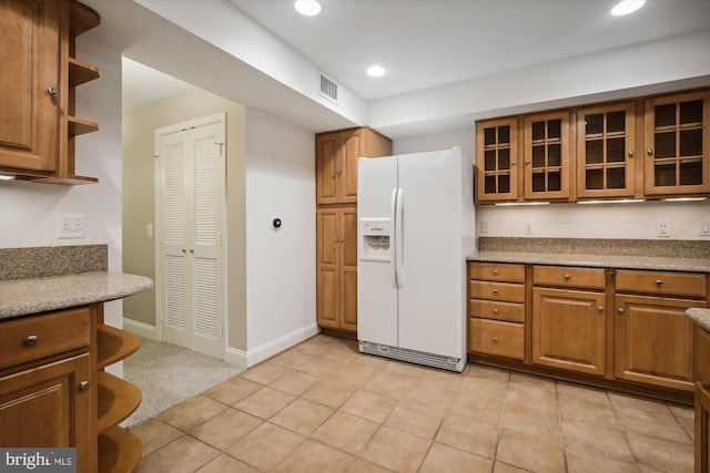 1240 Girard St NW, Washington, DC 20009 - kitchen with white refrigerator with ice dispenser, open shelves, brown cabinets, and recessed lighting
