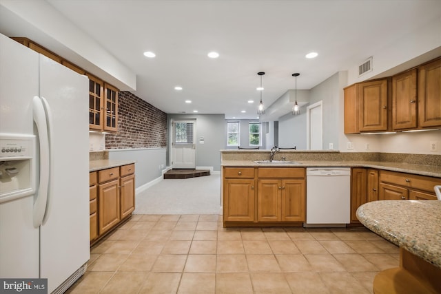 1240 Girard St NW, Washington, DC 20009 - kitchen with white appliances, light carpet, glass insert cabinets, recessed lighting, and brown cabinetry