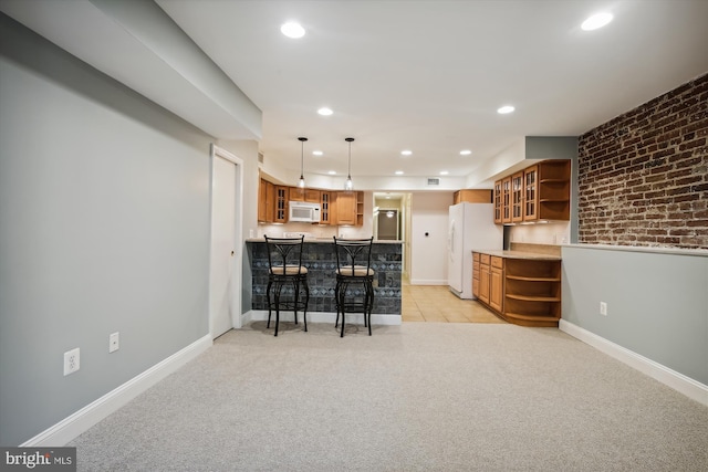 1240 Girard St NW, Washington, DC 20009 - kitchen with open shelves, white appliances, a breakfast bar area, recessed lighting, and light carpet