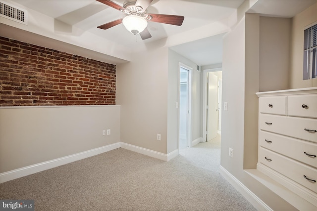 1240 Girard St NW, Washington, DC 20009 - carpeted spare room with a ceiling fan and brick wall