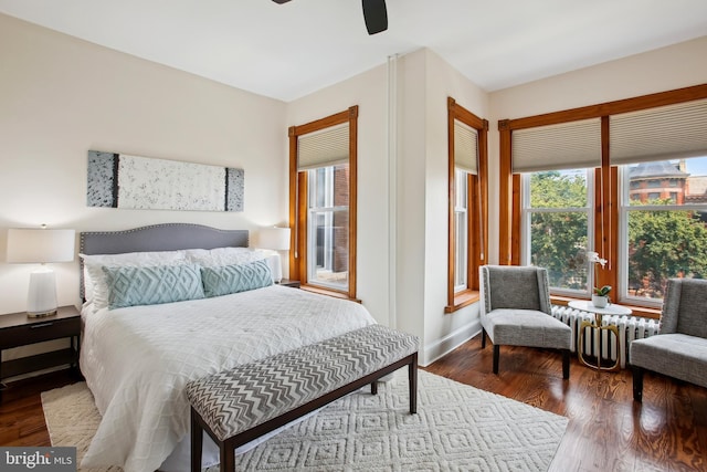 1240 Girard St NW, Washington, DC 20009 - bedroom featuring radiator, wood finished floors, and a ceiling fan