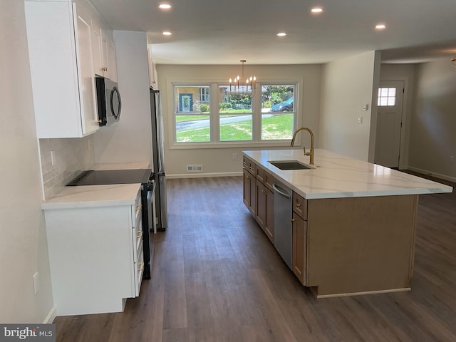 7804 Alberta Ct, Springfield, VA 22152 - kitchen featuring appliances with stainless steel finishes, an island with sink, dark wood-style floors, recessed lighting, and white cabinets