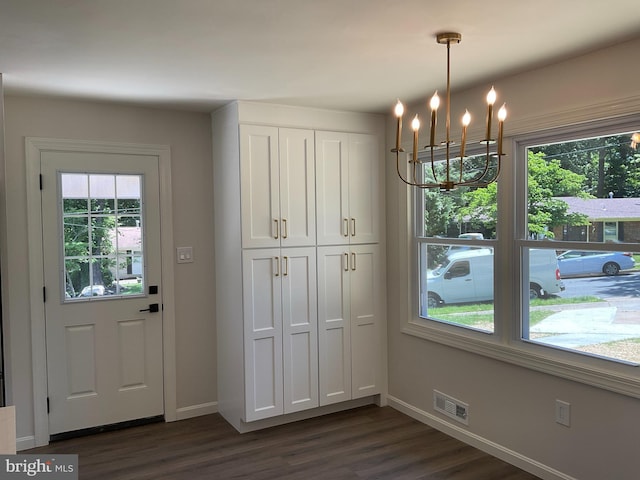 7804 Alberta Ct, Springfield, VA 22152 - doorway with dark wood finished floors and a chandelier