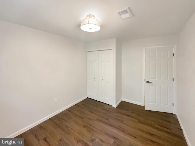 7804 Alberta Ct, Springfield, VA 22152 - unfurnished bedroom featuring dark wood finished floors and a closet