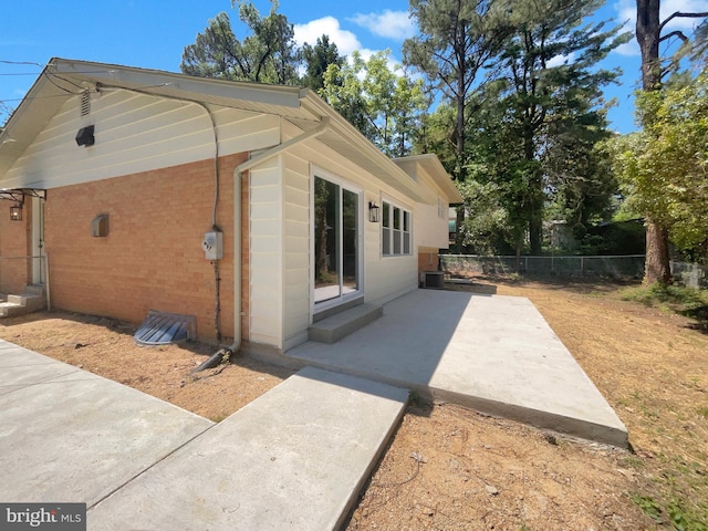 7804 Alberta Ct, Springfield, VA 22152 - view of property exterior with brick siding and a patio area