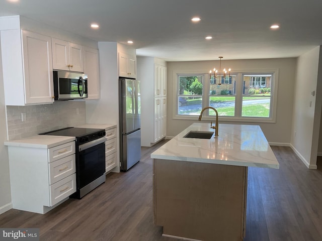 7804 Alberta Ct, Springfield, VA 22152 - kitchen featuring appliances with stainless steel finishes, decorative backsplash, white cabinets, dark wood-style flooring, and recessed lighting