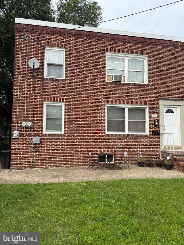 2212 Cove Rd, Pennsauken, NJ 08110 - view of front facade featuring brick siding and a front yard