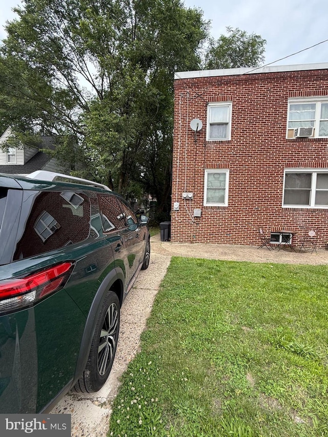 2212 Cove Rd, Pennsauken, NJ 08110 - view of side of home with a yard and brick siding