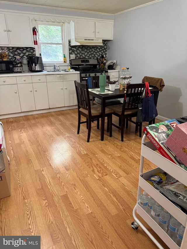 2212 Cove Rd, Pennsauken, NJ 08110 - dining area featuring light wood-style floors and ornamental molding