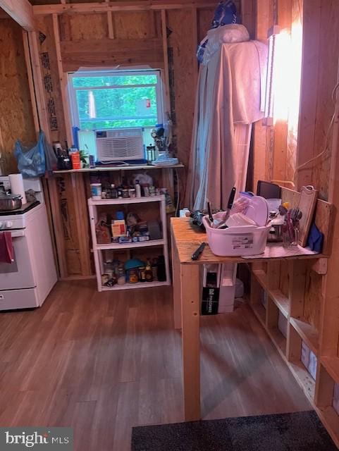 659 Falconwood Rd, Paw Paw, WV 25434 - misc room featuring wood finished floors, cooling unit, and wood walls