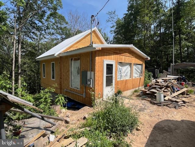 659 Falconwood Rd, Paw Paw, WV 25434 - view of side of home featuring a metal roof