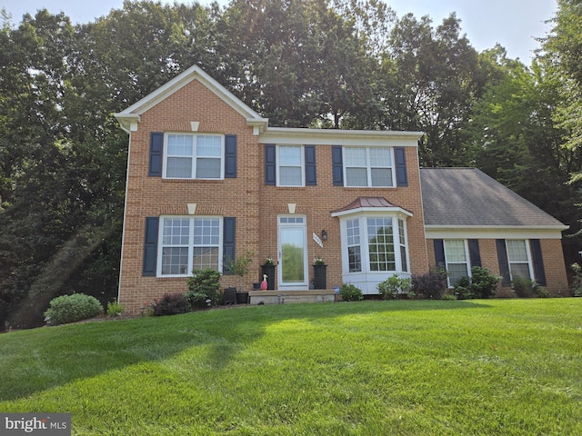 15021 Nightfall Ln, Woodbridge, VA 22193 - view of front of home with brick siding and a front lawn