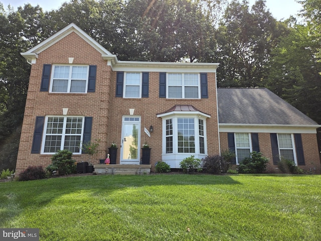 15021 Nightfall Ln, Woodbridge, VA 22193 - view of front of house featuring a front yard and brick siding