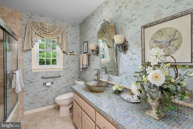 3847 Quakerbridge Rd, Hamilton, NJ 08619 - bathroom with vanity, combined bath / shower with glass door, tile patterned flooring, and wallpapered walls