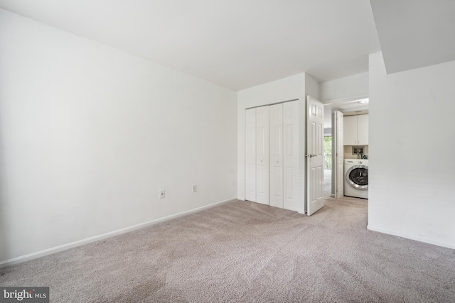 9810 Kingsbridge Dr Unit 102, Fairfax, VA 22031 - unfurnished bedroom with washer / clothes dryer, light carpet, and a closet