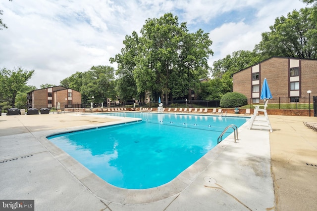 9810 Kingsbridge Dr Unit 102, Fairfax, VA 22031 - community pool featuring a patio