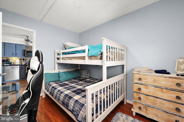 14 136th St Unit 101, Ocean City, MD 21842 - bedroom with wood finished floors and a textured ceiling