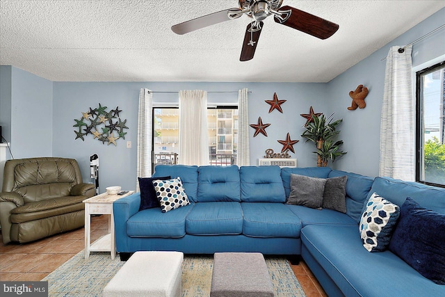 14 136th St Unit 101, Ocean City, MD 21842 - tiled living area with a ceiling fan and a textured ceiling