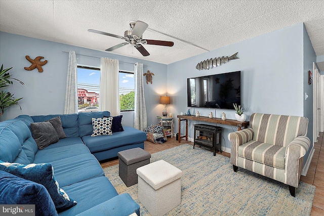 14 136th St Unit 101, Ocean City, MD 21842 - living area with ceiling fan, tile patterned floors, and a textured ceiling