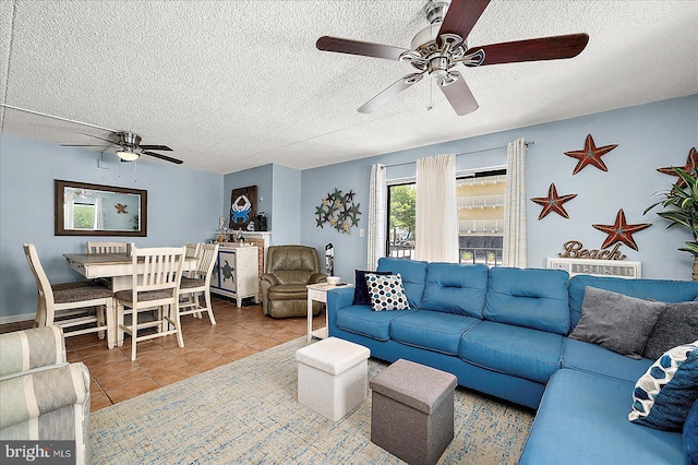 14 136th St Unit 101, Ocean City, MD 21842 - living area featuring a ceiling fan, tile patterned floors, and a textured ceiling