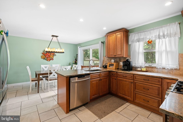 478 Alexander Ave, Maple Shade, NJ 08052 - kitchen featuring stainless steel dishwasher, brown cabinets, backsplash, a peninsula, and pendant lighting