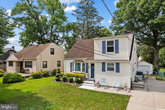 478 Alexander Ave, Maple Shade, NJ 08052 - view of front of home featuring a detached garage, a chimney, and an outbuilding