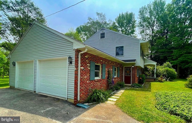 21 Long Ln, Malvern, PA 19355 - view of front of house featuring an attached garage, brick siding, driveway, and a front lawn
