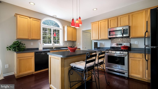 5510 Haverhill Ln, Doylestown, PA 18902 - kitchen featuring black appliances, dark countertops, light brown cabinets, dark wood-type flooring, and recessed lighting