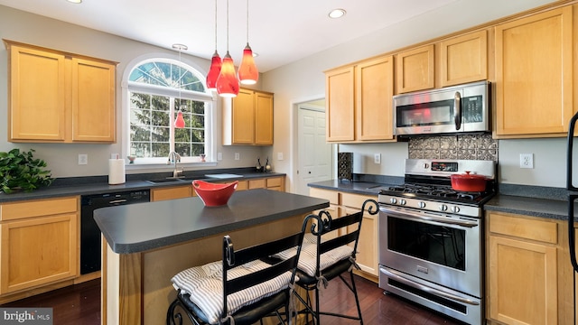 5510 Haverhill Ln, Doylestown, PA 18902 - kitchen featuring stainless steel appliances, light brown cabinets, dark countertops, recessed lighting, and dark wood-type flooring