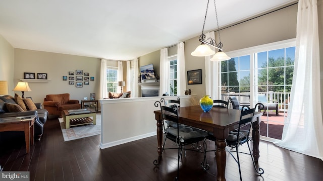 5510 Haverhill Ln, Doylestown, PA 18902 - dining space featuring a fireplace and dark wood-type flooring