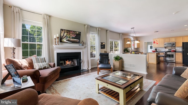 5510 Haverhill Ln, Doylestown, PA 18902 - living area with dark wood-type flooring, a fireplace with flush hearth, and recessed lighting