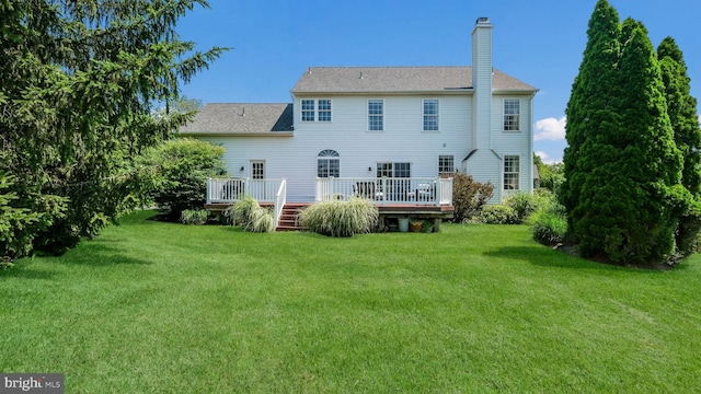 5510 Haverhill Ln, Doylestown, PA 18902 - rear view of house with a chimney, a yard, a wooden deck, and roof with shingles