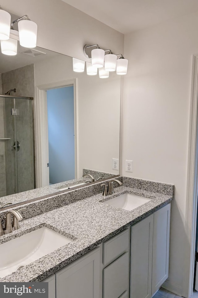 2305 Snow Rd, Edgewood, MD 21040 - bathroom featuring double vanity and a stall shower