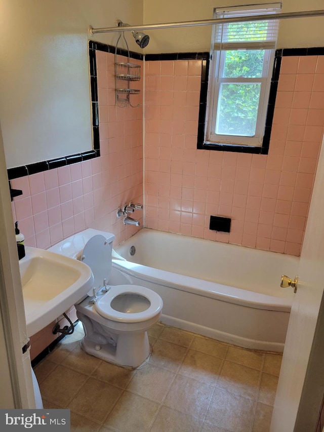 142 Fleetwood Ter, Silver Spring, MD 20910 - bathroom featuring bathing tub / shower combination, tile patterned flooring, and tile walls
