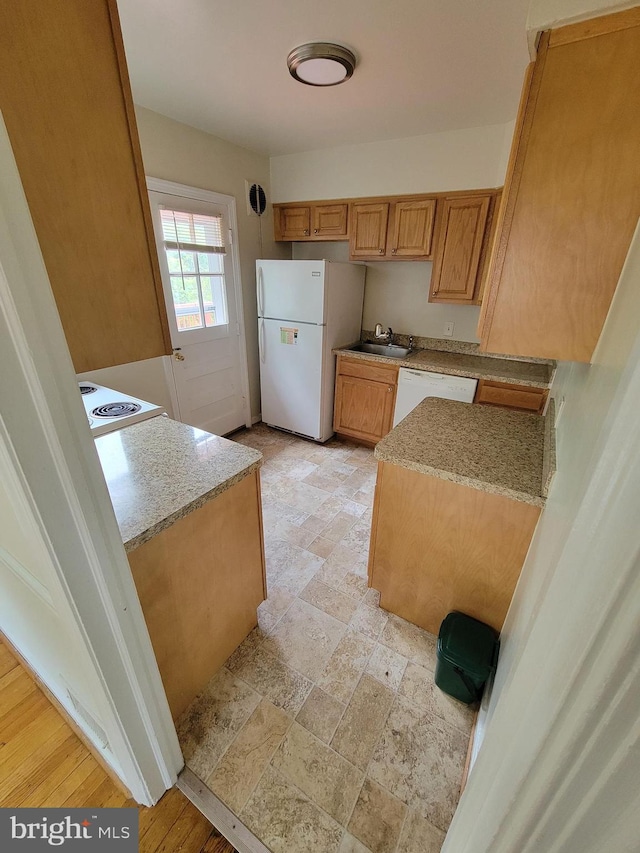 142 Fleetwood Ter, Silver Spring, MD 20910 - kitchen with white appliances, light stone countertops, and brown cabinetry