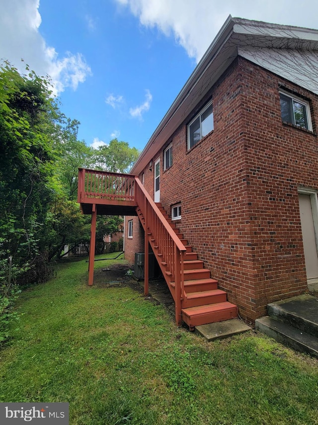 142 Fleetwood Ter, Silver Spring, MD 20910 - view of property exterior featuring stairs, a lawn, brick siding, and a wooden deck