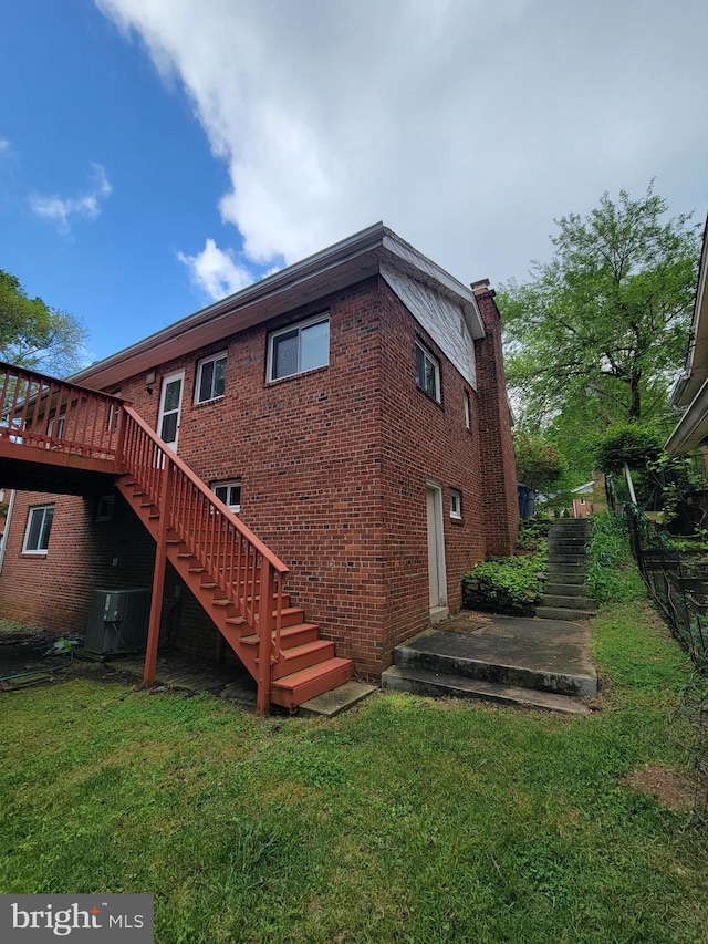 142 Fleetwood Ter, Silver Spring, MD 20910 - back of property featuring stairs, a yard, brick siding, and a wooden deck