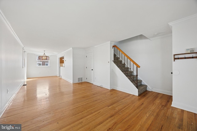 236 Lynn Rd, Ridley Park, PA 19078 - unfurnished living room featuring stairs, ornamental molding, and light wood-style floors