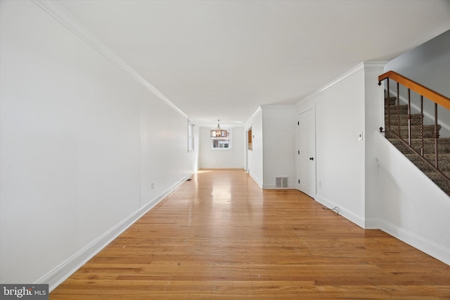 236 Lynn Rd, Ridley Park, PA 19078 - corridor featuring light wood-style flooring, ornamental molding, and stairway