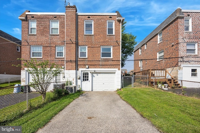 236 Lynn Rd, Ridley Park, PA 19078 - back of house featuring an attached garage, asphalt driveway, and brick siding