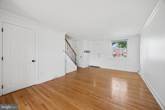 236 Lynn Rd, Ridley Park, PA 19078 - unfurnished living room featuring stairs, light wood-style flooring, and ornamental molding